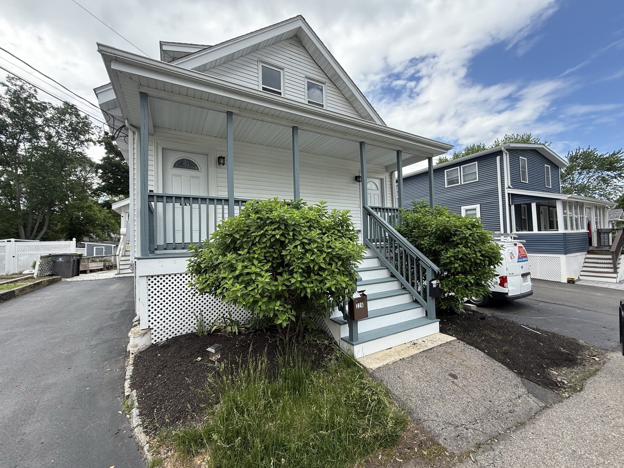 White New England home with a covered front porch