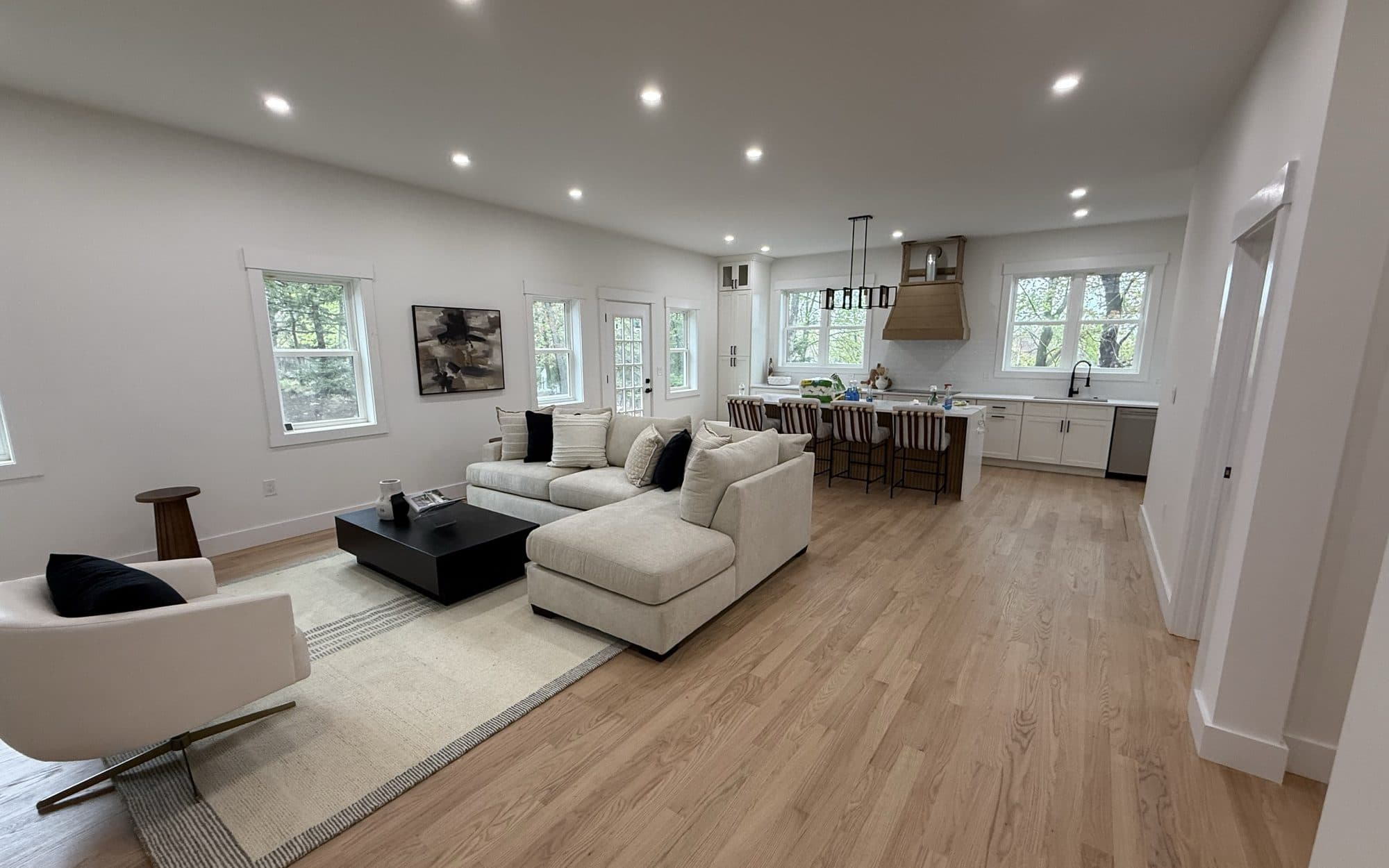 Bright open-plan living room and kitchen after a full interior repaint