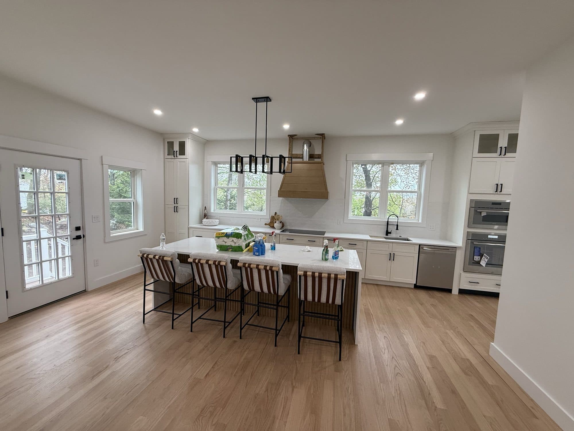 White kitchen with a large island and counter seating