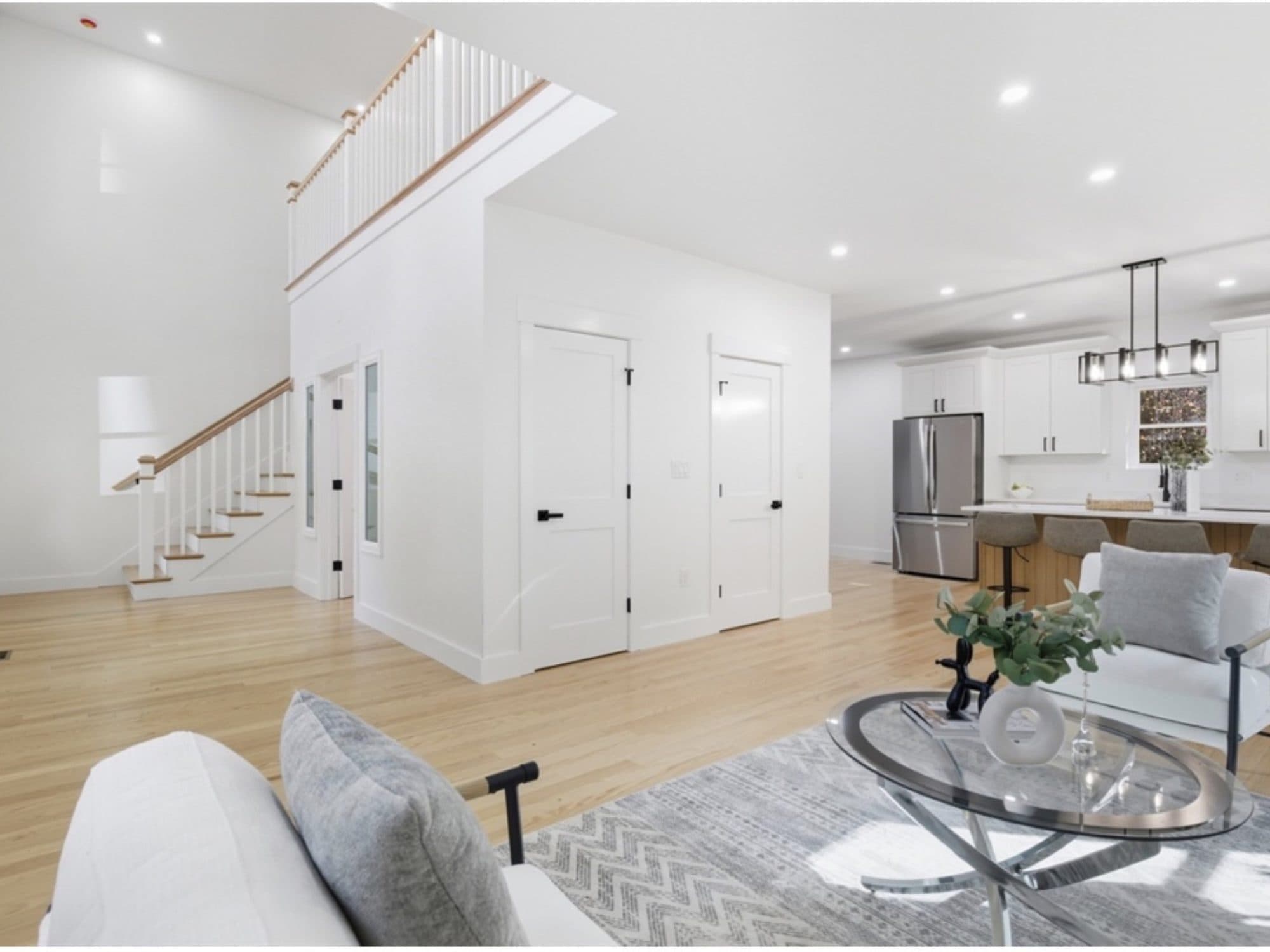 Staged open-plan living area opening onto the kitchen