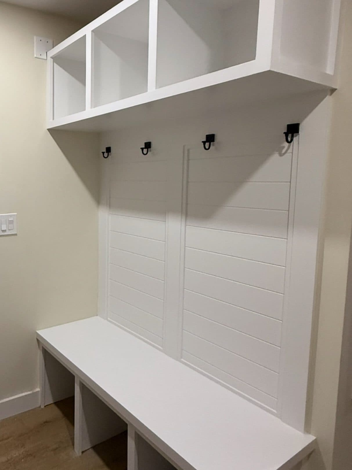 Mudroom bench and cubbies painted white