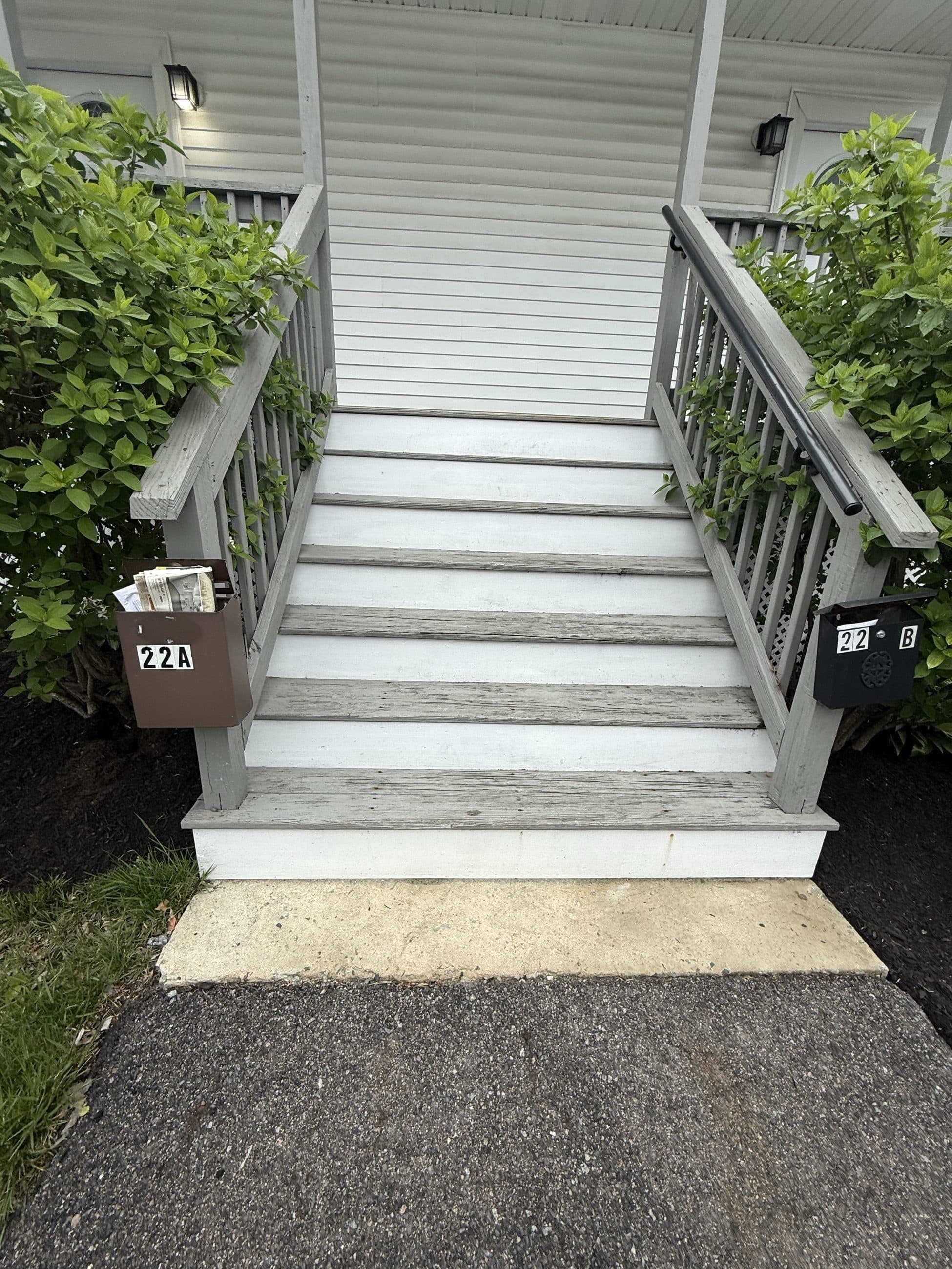 Exterior stairs with painted risers and grey treads